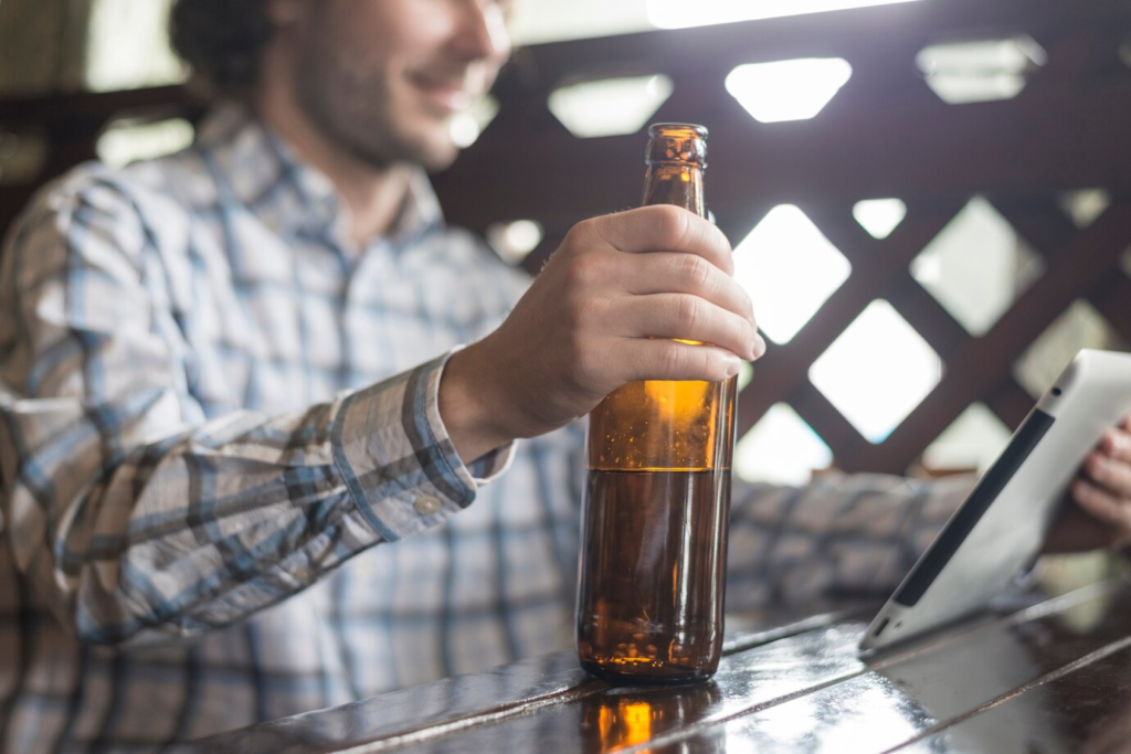 a lonely guy using beer platform