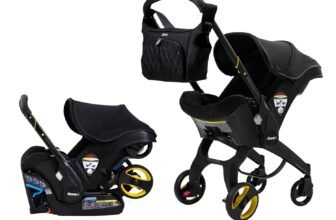 "Doona Car Seat & Stroller Midnight Edition all-in-one travel system in stroller mode with black canopy and wheels"